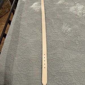 Top grain white leather belt with silver buckle.